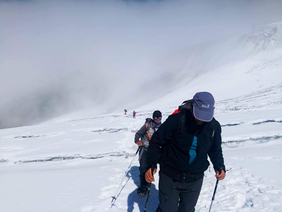 Climbers climbing on glacier on Mera Peak