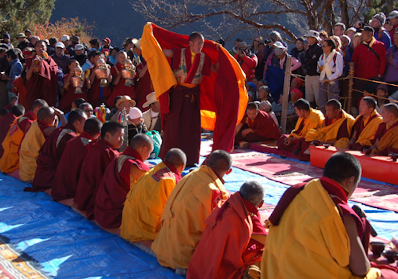 Buddhist monks performing dance Phutak Festival in Olangchung Glola
